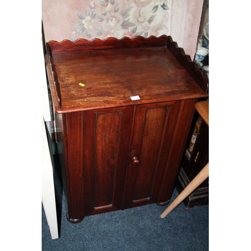 824 - Victorian mahogany ledge-back two door cabinet, on bun supports.