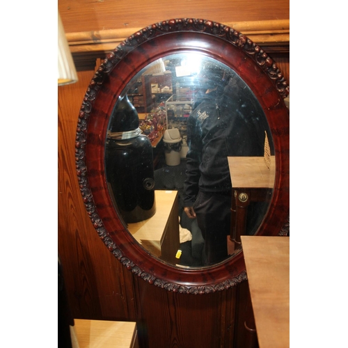 836 - Hardwood framed bevel-edge oval wall mirror, 75 x 58cm.