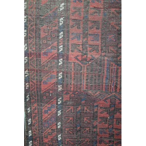 847 - Large Turkish red ground rug, with geometric decoration, 179 x 102cm.