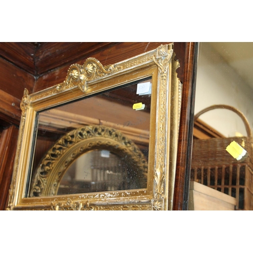 830 - Gilt framed rectangular wall mirror, with surmount, 36 x 50cm.