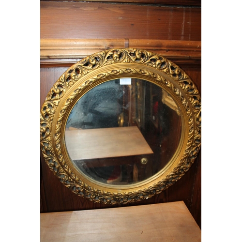 834 - Gilt framed round wall mirror, 56cm diameter.