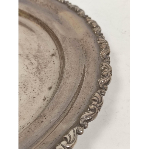 1 - Egyptian silver circular waiter with scroll border, 34cm, 832g.