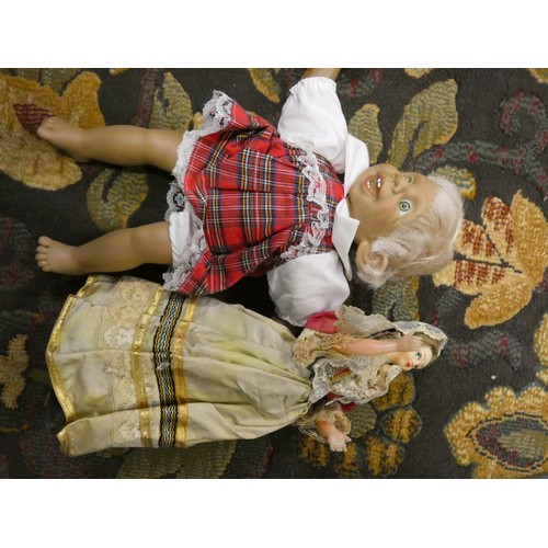 149 - Two boxes of miscellaneous items to include dolls, brassware, etc.