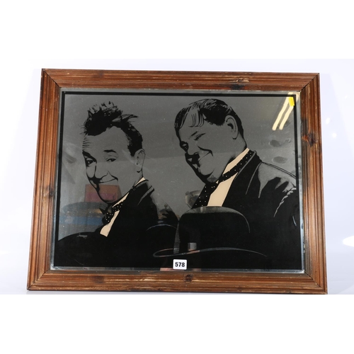 578 - Framed Laurel and Hardy advert mirror, frame size 53cm x 69cm.