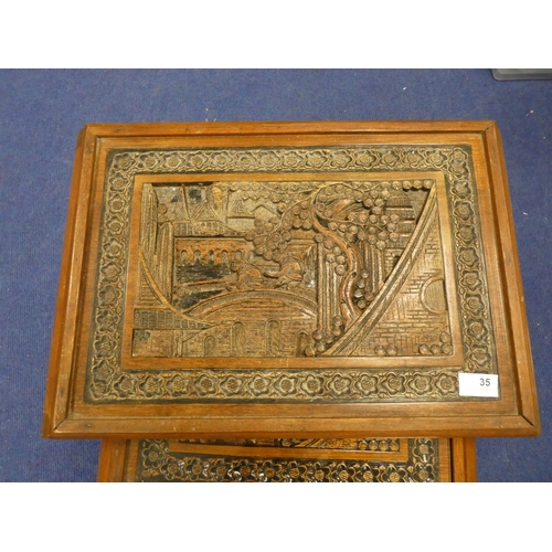 35 - Nest of four tables, Oriental design with carved tops.