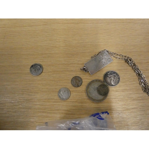 41 - Miscellaneous coins and silver ingot pendant and chain.