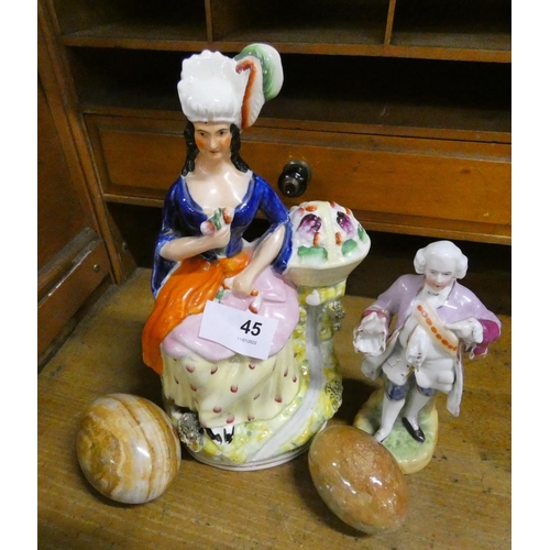 45 - Staffordshire figure and another and two polished stone eggs.