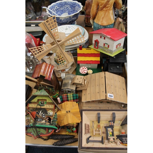 260 - Black Forest style wooden models to include a cuckoo clock, an interior scene, etc.