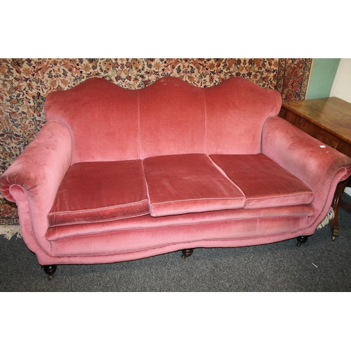 711 - Victorian mahogany pink upholstered shaped back scroll arm sofa.