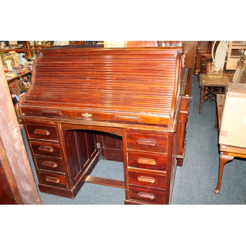 714 - Victorian mahogany roll top eight drawer knee-hole desk.