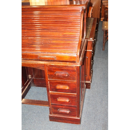 714 - Victorian mahogany roll top eight drawer knee-hole desk.