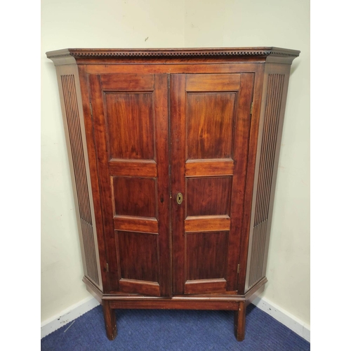 543 - 19th century mahogany corner cupboard with two panelled doors enclosing a shelved interior, on a fix... 