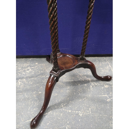 547 - 19th century mahogany wig stand with circular recess above a saucer shelf on spiral columns and trip... 