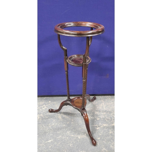 547 - 19th century mahogany wig stand with circular recess above a saucer shelf on spiral columns and trip... 