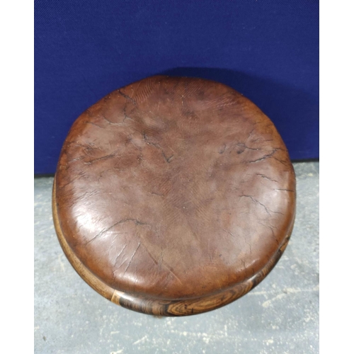 548 - Rosewood and mahogany revolving piano stool;, circa late 19th century, with a brown hide stuffover s... 