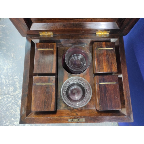 549 - Regency rosewood teapoy, circa early 19th century, the hinged top enclosing four fitted compartments... 