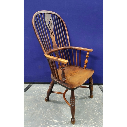 551 - 19th century ash and elm Windsor armchair, with a high hoop spindle back, above a curved solid seat,... 