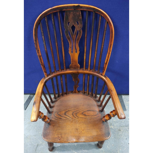 551 - 19th century ash and elm Windsor armchair, with a high hoop spindle back, above a curved solid seat,... 