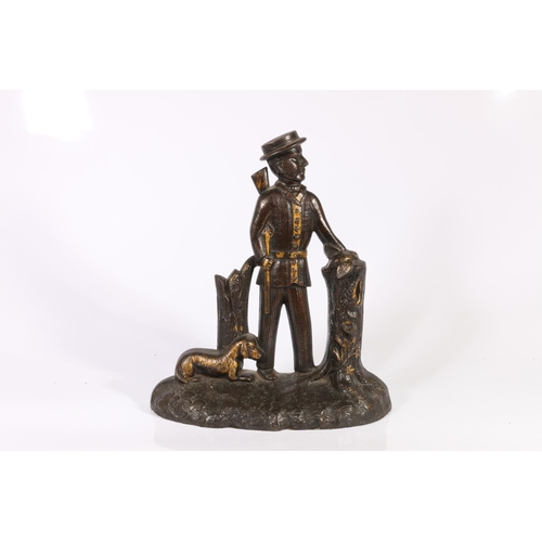 14 - Cast iron doorstop, depicting hunter and dog, 26cm.