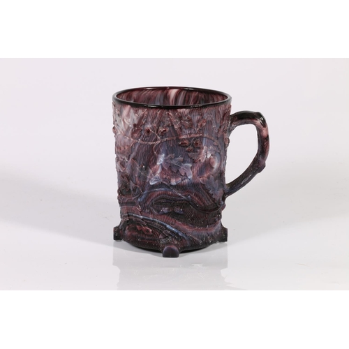 62 - Moulded glass mug with foliate decoration, 10cm.