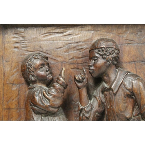 182 - 19th or early 20th century deep relief carved wooden panel depicting two boys smoking, entitled 