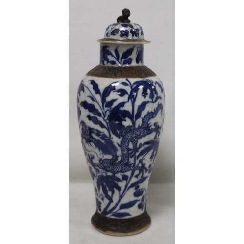 183 - Chinese crackle glaze blue and white vase of baluster form decorated with scrolling dragons amongst ... 