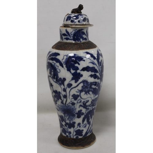 183 - Chinese crackle glaze blue and white vase of baluster form decorated with scrolling dragons amongst ... 