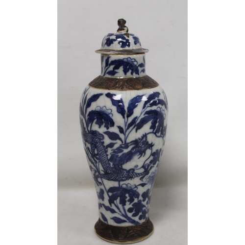 183 - Chinese crackle glaze blue and white vase of baluster form decorated with scrolling dragons amongst ... 