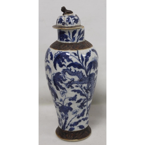 183 - Chinese crackle glaze blue and white vase of baluster form decorated with scrolling dragons amongst ... 