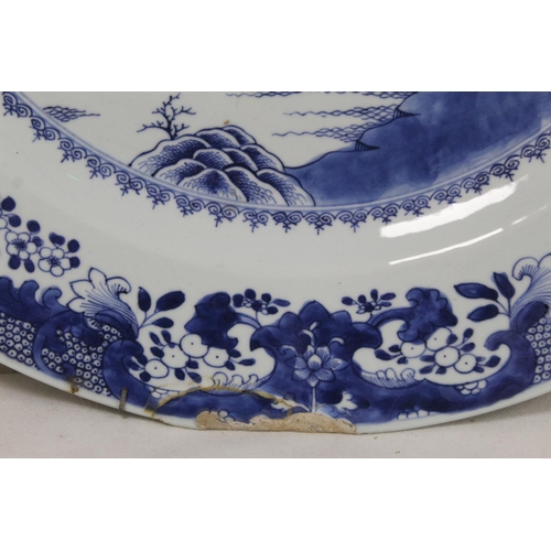 188 - Large 18th century Chinese blue and white porcelain charger of circular form, the central panel depi... 