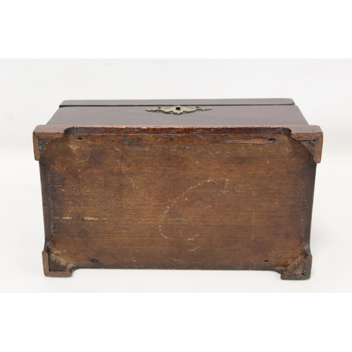 204 - Georgian mahogany tea caddy of rectangular form on four bracket feet with single brass swing handle ... 