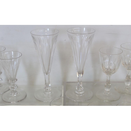 212 - Collection of fifteen antique drinking glasses including: a pair of flutes with faceted trumpet bowl... 