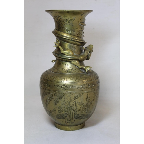 216 - Chinese brass vase of baluster form with incised panels of figures, precious things and moulded scro... 