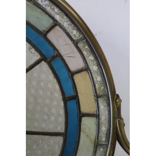 217 - Late 19th/early 20th century firescreen, the circular leaded stained glass panel with flowerhead mot... 