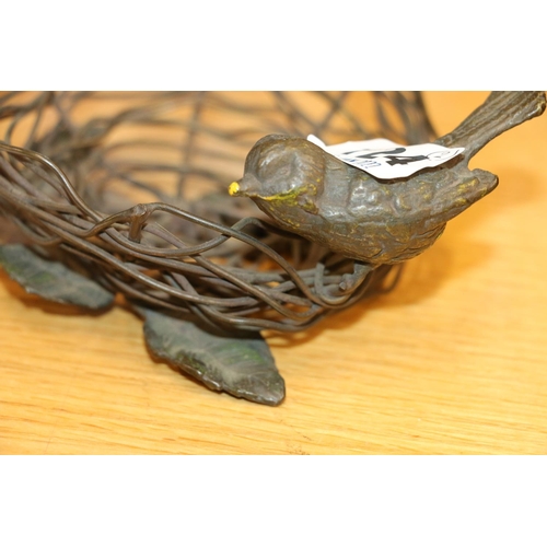 124 - Indian stone set model of a bird and a bronzed sculpture of a bird nest.