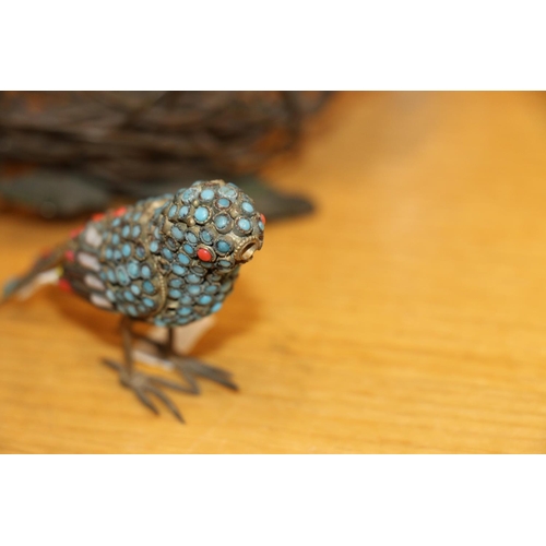 124 - Indian stone set model of a bird and a bronzed sculpture of a bird nest.