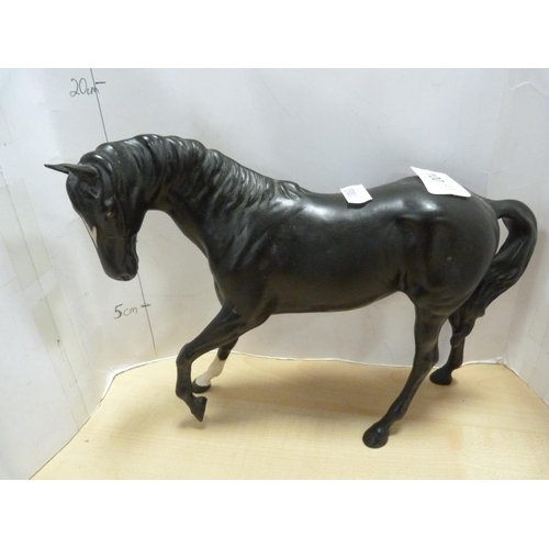 100 - Four assorted Beswick horse figures including Shetland pony, one glazed in black, smaller black glaz... 