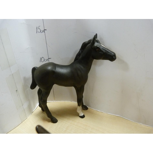 100 - Four assorted Beswick horse figures including Shetland pony, one glazed in black, smaller black glaz... 