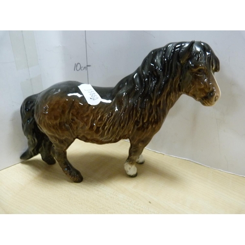 100 - Four assorted Beswick horse figures including Shetland pony, one glazed in black, smaller black glaz... 