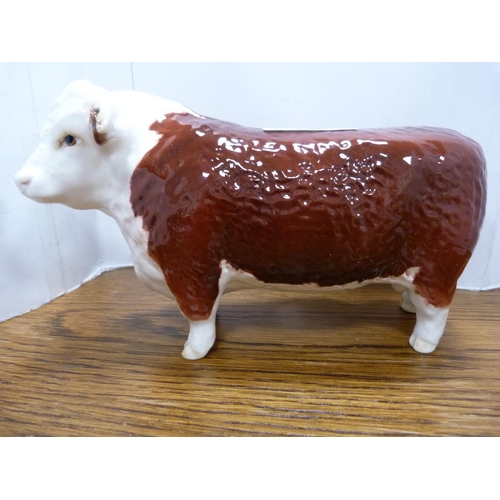 102 - Set of four Beswick cow figures including 'Champion of Champions'.