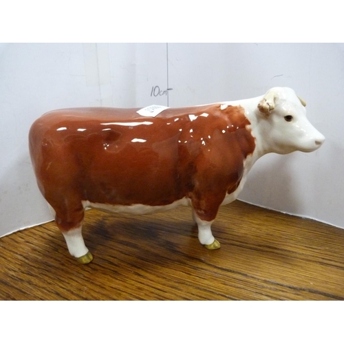 102 - Set of four Beswick cow figures including 'Champion of Champions'.