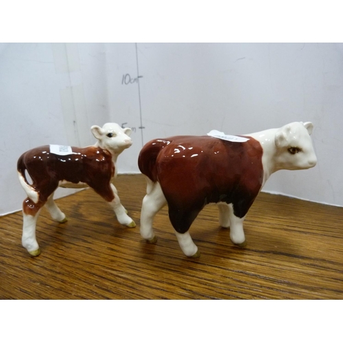 102 - Set of four Beswick cow figures including 'Champion of Champions'.