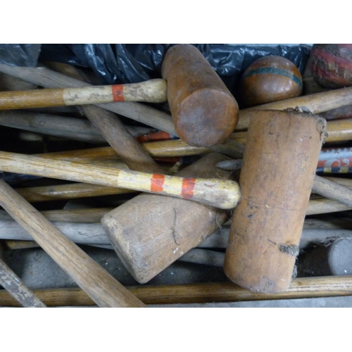 105 - Croquet set contained in a wooden box.