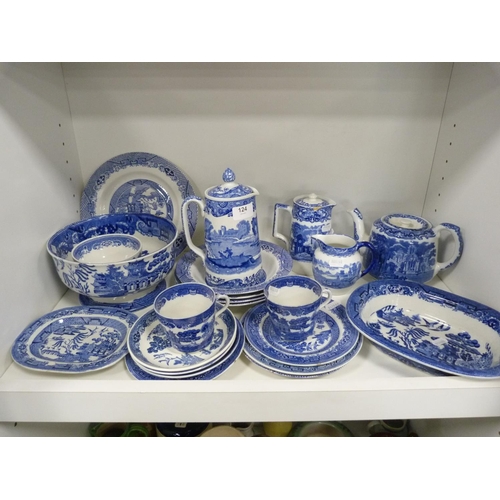 124 - Collection of 'Willow' pattern blue and white tableware including cups and saucers, rum butter bowl,... 