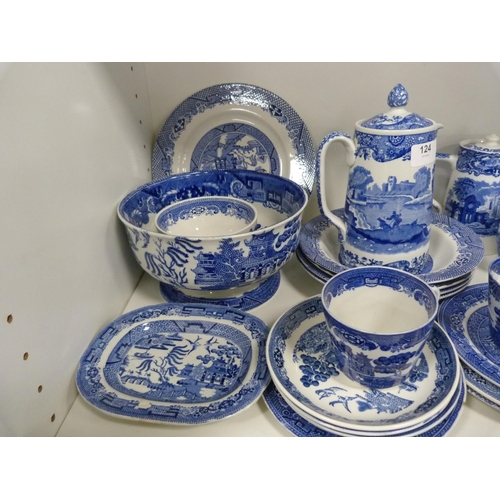 124 - Collection of 'Willow' pattern blue and white tableware including cups and saucers, rum butter bowl,... 