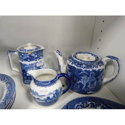 124 - Collection of 'Willow' pattern blue and white tableware including cups and saucers, rum butter bowl,... 