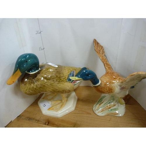 73 - Group of Beswick ducks including three graduated flying ducks, no. 590-2, another flying duck figure... 