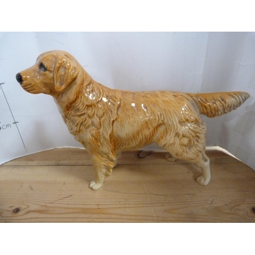 77 - Four Beswick dog figures including a Golden Retriever, Red Setter etc.  (4)