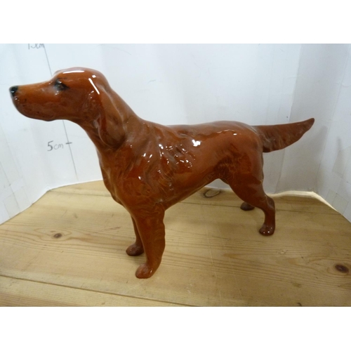 77 - Four Beswick dog figures including a Golden Retriever, Red Setter etc.  (4)