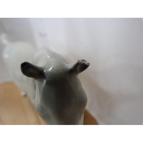 81 - Four Beswick dapple grey horses of various sizes including Arab Xayal, no. 1265.  (4)